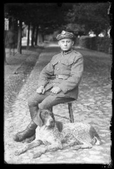 Portrait of a soldier with a dog