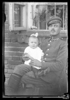 Soldier holding a child