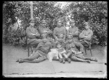 A boy and a group of military men