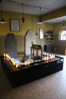 The interior of the ohel at the Jewish cemetery in Rymanów