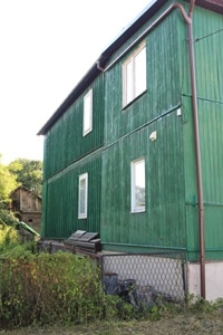 Elewacja boczna domu drewnianego przy ulicy Wyzwolenia 1 w Szczebrzeszynie