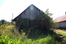 Ściana szczytowa domu drewnianego przy ulicy 3 Maja 59 w Tyszowcach