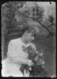 Portrait of a woman sitting on a chair